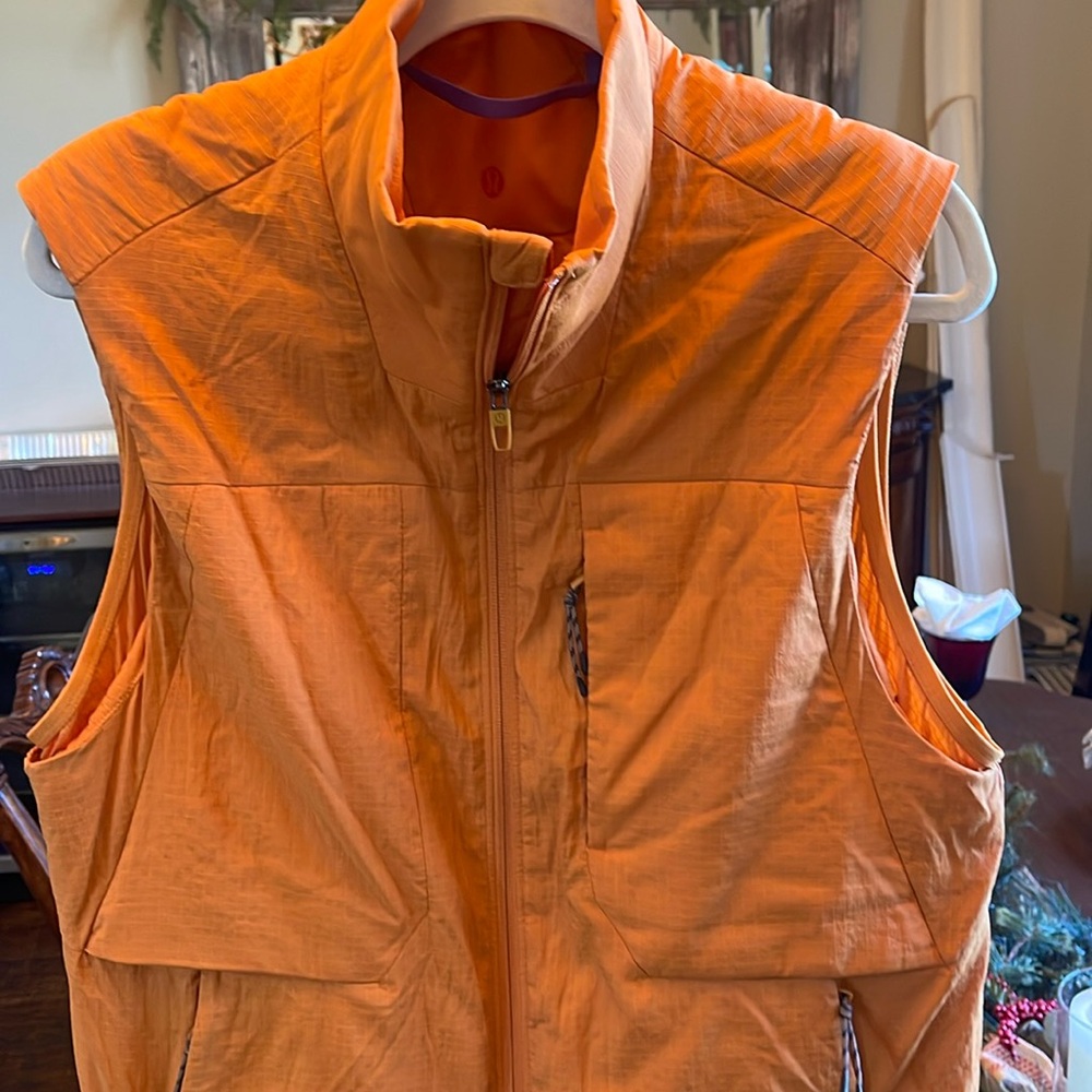 Men’s Lululemon orange vest, size small.